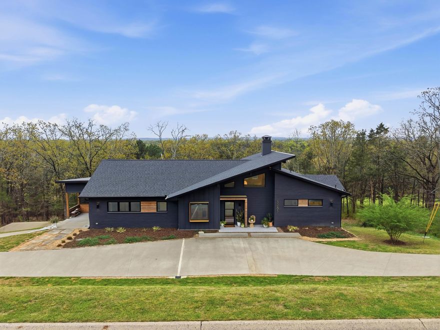 Stunning 4 bed 3 1/2 bath home in Nob Hill subdivision w/2 living areas, modern design & incredible views! This custom built home w/striking front entry featuring wood inlay detail & glass & iron door. The light filled foyer opens into a beautiful open floor plan w/abundant natural light & wonderful views. The main living area offers gorgeous fireplace focal point & dramatic floor to ceiling accent wall. The spacious dining area provides ample room for entertaining & flows into the custom kitchen w/quartz countertops, large center island w/seating, custom cabinetry, stainless steel appliances. The primary suite is a true retreat w/private access to a deck overlooking the property. The en suite bathroom has a fully tiled wet area w/soaker tub & custom tile walk in shower, floating double vanities & large walk in closet. An additional guest bedroom w/private bath & flex room ideal for an office or optional fifth bedroom are also located on the main level. Downstairs: 2 additional guest bedrooms, shared hall bath & second large living area. Laundry room on first and second floor. Enjoy outdoor living w/screened in porch, expansive deck space & some of the most beautiful views around!