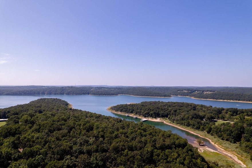 This 28.75-acre gem offers highway frontage, perfect for easy access. The majority of the land is wooded, providing a serene and private setting. You’ll also find 2 private wells and a heated and cooled 32×50 mechanics shop with two bays as well as a full bath, making it convenient for any car enthusiast. The shop is livable, if you wanted to build on the property. The property is adjacent to government land and is just a stone’s throw away from the beautiful North Fork Lake. While the mobile home on the property suffered fire damage, there are several outbuildings available. With a circle drive and abundant wildlife, this place is a nature lover’s dream! This versatile land has incredible potential for development. With its size and location, it could be transformed into various opportunities such as Airbnb getaways or even an RV hook-up campsite. The possibilities are endless! Access close to the water for fishing, boating and kayaking and don’t forget all the wildlife for hunting or to just to sit and watch. Call me today to check out this amazing property.