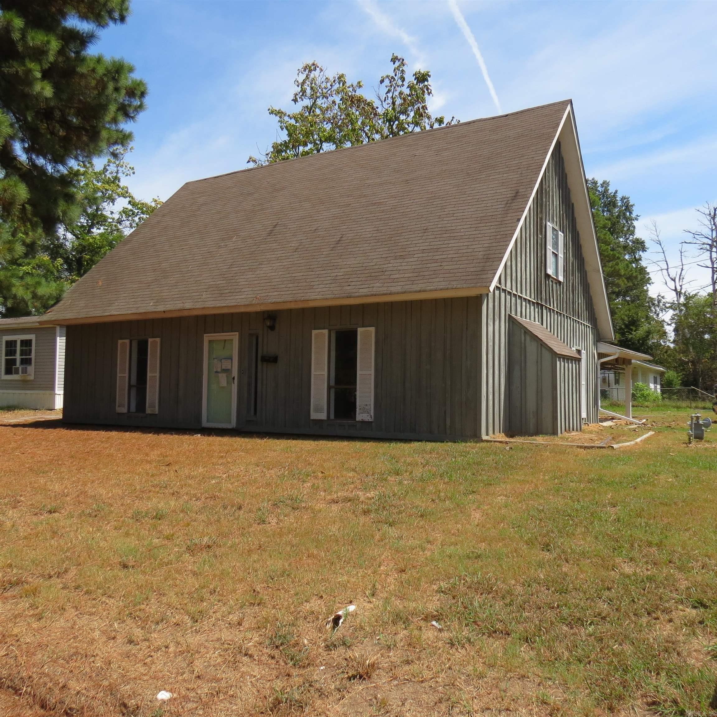 This 2 story home sits on a corner lot! 1 bedroom and bath downstairs, 2 bedrooms and bath upstairs. Separate laundry room. Gas fireplace. Exterior storage by carport. Add your personal touches to make this your new home!! Call today for your personal tour. **Agents See Remarks**