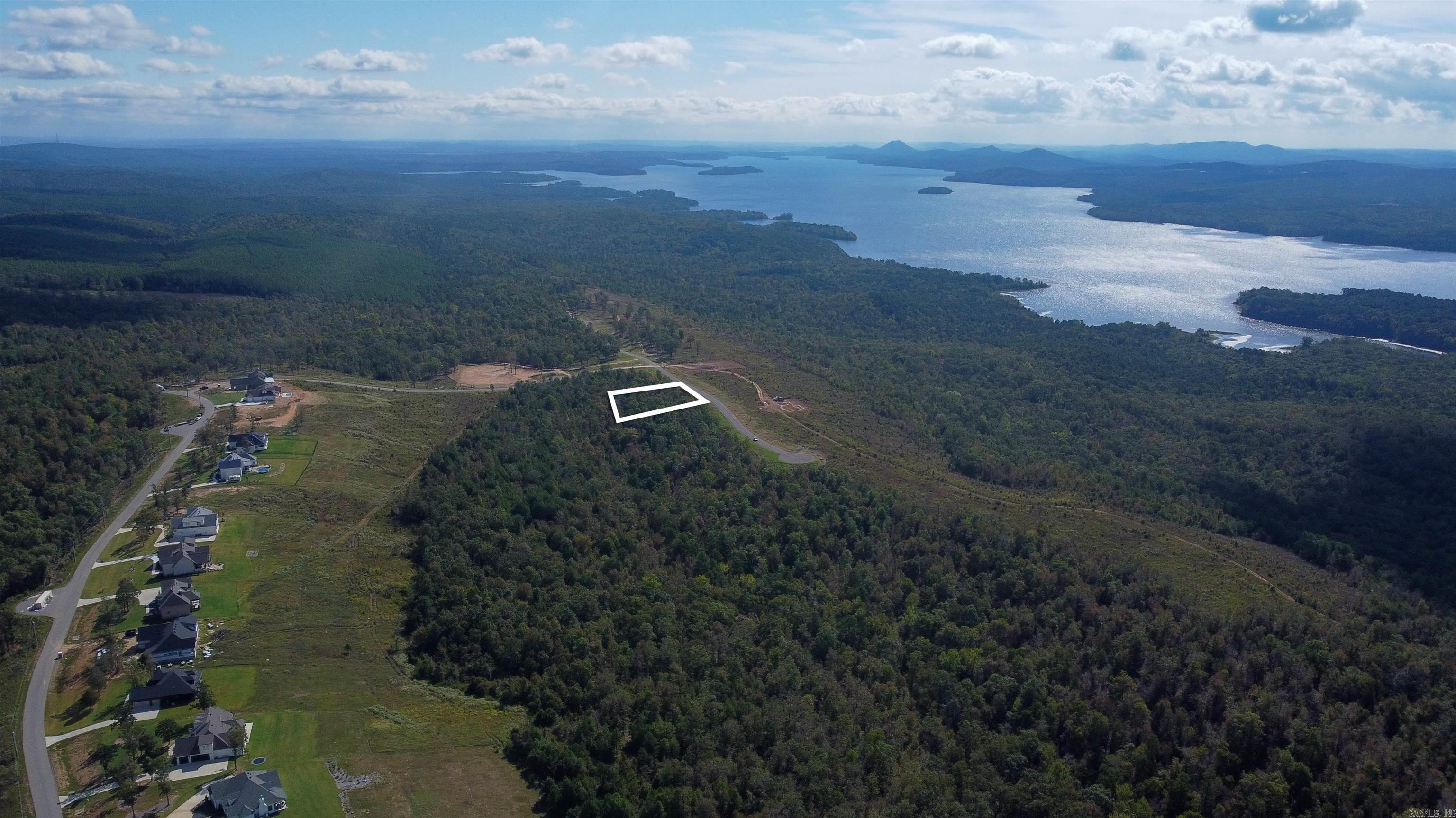 Lakeview West highlights the enchanting beauty of Arkansas, presenting an incredible opportunity for outdoor enthusiasts. This 0.91-acre lot backs up to scenic walking and biking trails, providing easy access to nature right from your doorstep. Enjoy panoramic views of the majestic mountains and expansive skies, making it the perfect setting to build your dream home. Take advantage of this chance to create your ideal living space in such a picturesque environment!