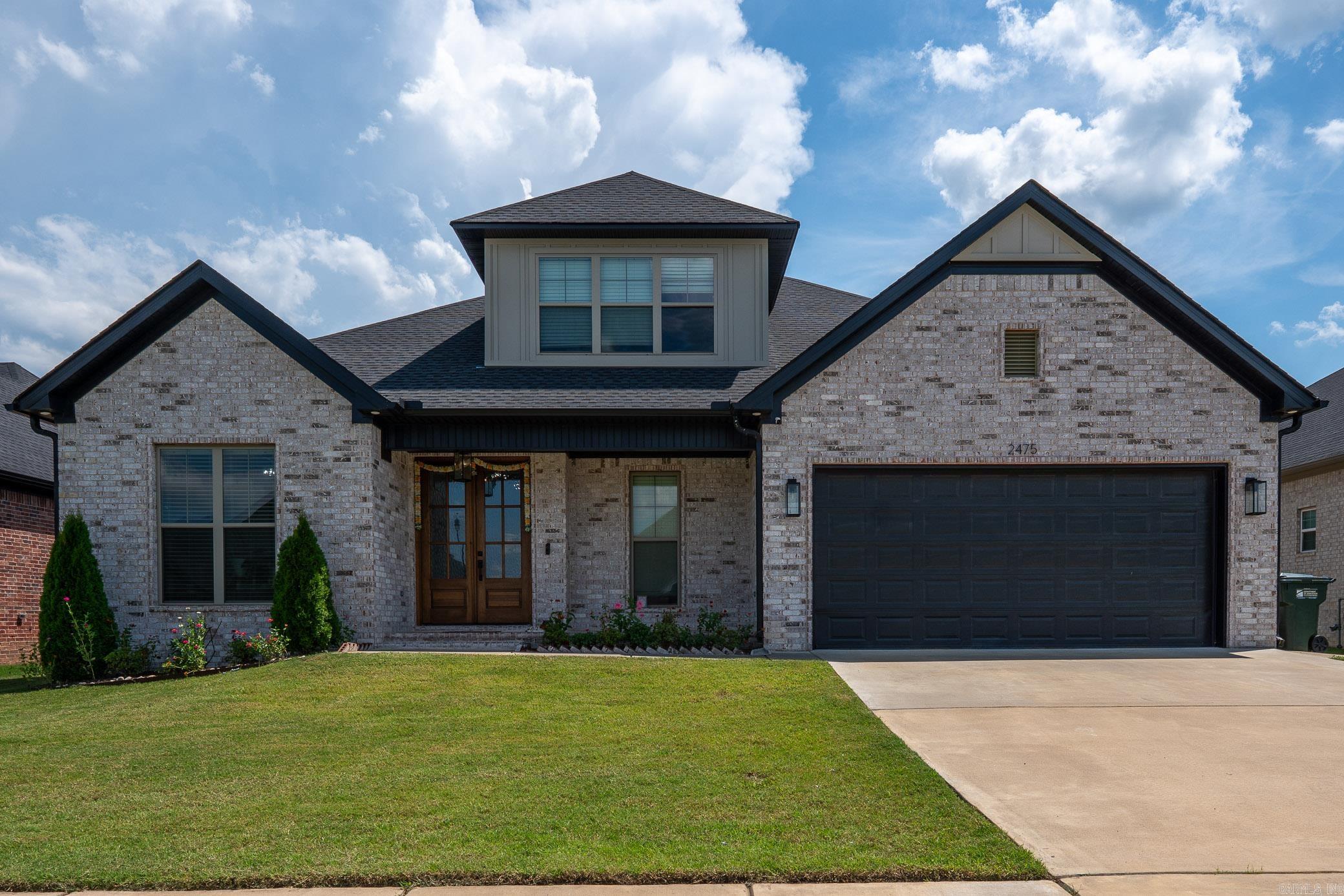 Custom-built beauty in the desirable Robynmar Subdivision! This like-new home features soaring ceilings and a thoughtfully designed layout with quartz countertops, a massive kitchen island, and a rare walk-around pantry—perfect for entertaining or everyday living. The chef’s kitchen includes a gas range and flows seamlessly into the open-concept living area. The spa-like primary bathroom offers a relaxing retreat with upscale finishes, and the huge walk-in closet provides plenty of storage. Step outside to a covered patio with an outdoor prep station and sink, ideal for backyard gatherings. A golf cart garage on the side adds extra functionality. Don’t miss this stunning home in one of the area’s newest neighborhoods.