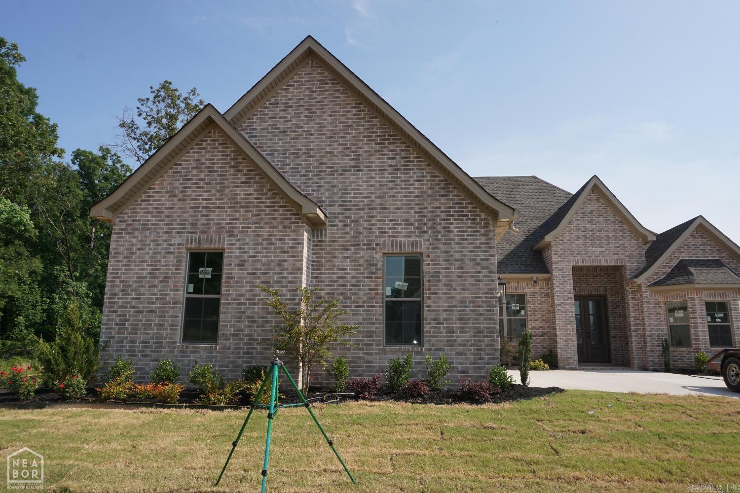 Welcome to your dream home! This brand new construction boasts 4 spacious bedrooms and 3 luxurious bathrooms, offering 3,200 square feet of beautifully designed living space. The heart of the home is the great room, featuring a cozy fireplace and soaring 10-foot ceilings that create an open and airy atmosphere. The chef's kitchen is a true highlight, complete with a charming breakfast room, a walk-in pantry, sleek stainless steel appliances, and ample cabinetry, making it the perfect space for both cooking and entertaining. Adjacent to the kitchen is a formal dining room, ideal for hosting family gatherings or dinner parties. The home also features a convenient laundry room with a sink, adding to the functionality and ease of daily living. The master suite is a true retreat, offering a boxed ceiling for added elegance and a spacious layout. The master bath is designed for relaxation with a luxurious soaker tub, a walk-in tile shower, dual sinks, and an expansive walk-in closet. Enjoy outdoor living with a charming covered front porch and a screened-in back porch, ideal for relaxing or entertaining while enjoying the beauty of the outdoors, year-round.