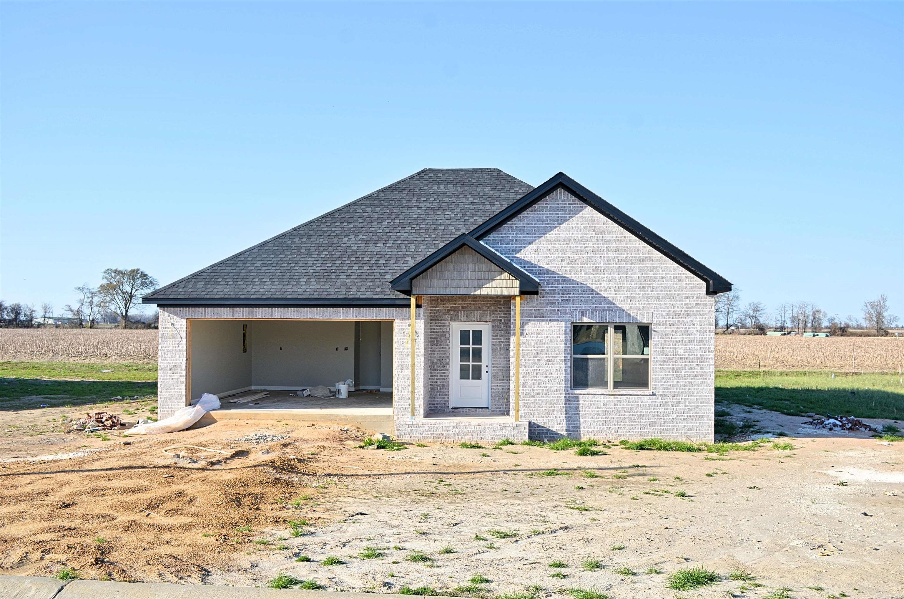 By using the builder's preferred lender, he is offering 5.25% financing to qualified buyers. Full of Charm in Wildcat-Country. Welcome to your next home sweet home a beautiful all-brick 3 bed, 2 bath gem tucked into an established neighborhood where neighbors wave and Wildcats rule the school! From the moment you walk in, you'll feel the heart of this home: Highlights you'll love: Open concept living space, Cozy natural gas fireplace to gather around on chilly nights. Modern kitchen with: Granite countertops & a large island w/ built-in storage. Gas range for delicious home-cooked meals. The spacious primary suite featuring: Tile shower & relaxing soaker tub. Step outside and you'll find yourself in a friendly neighborhood filled with other beautiful homes a great place to come home to, enjoy evening strolls, or cheer on your favorite Wildcat at the next local game! And the best part? All of this, priced WELL under $250,000! The location of the home qualifies for Rural Development / no money down financing with buyer approval. This home is move-in ready and waiting for YOU! **construction in progress**
