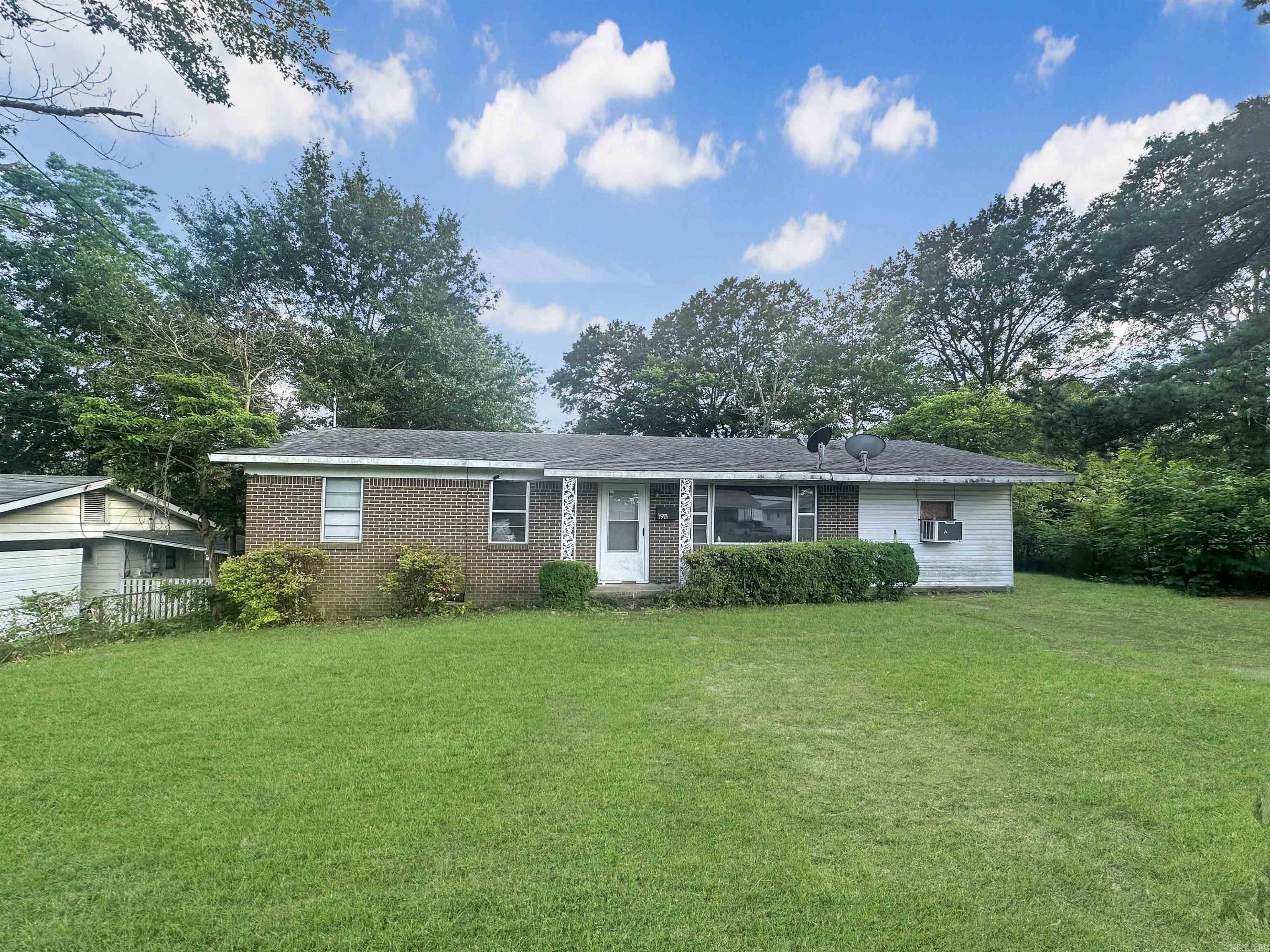 Excellent investment potential. Property sits nestled in this well established neighborhood. Close to hospital and airport. Sitting on two city lots there's plenty of room for hobbies or kids to play. Just in need of a little TLC.