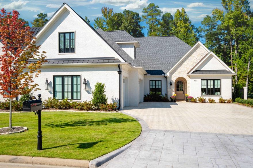 Discover elegance & luxury in this custom-built home adjacent to hole 11 of the Chenal Country Club Bear Den course. 100 Hallen Court offers a perfect blend of sophistication & comfort that features impeccable craftsmanship & high-end finishes throughout. The open-concept layout seamlessly connects spacious living & dining areas filled with natural light & picturesque golf course views. The living room is enhanced by a striking pre-cast fireplace mantel. The gourmet kitchen is a chef's dream, equipped with Thermador appliances & stunning leathered quartzite countertops. The primary bedroom is a tranquil retreat, boasting heated bathroom floors & rich wood accents. The primary bedroom closet has laundry access. Upstairs, a versatile den with a kitchenette is ideal for entertainment. Two additional bedrooms provide ample space for guests or family. The exterior is a blend of painted brick & stone, highlighted by a warm pine front door. Enjoy outdoor living on the covered patio, complete with motorized privacy screens & surrounded by lush greenery. Modern conveniences include a three-car garage, car charger, a generator & a tankless water heater. This home is a true gem!