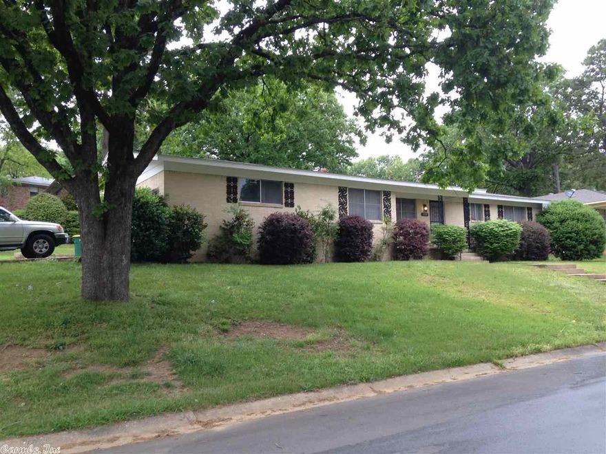 AWESOME DEAL! This spacious 3BR/2BA home sits on a huge corner lot and is conveniently located in the heart of Little Rock; just minutes away from hospitals, shopping, restaurants and interstates 430 & 630, you don't want to pass up this prime location! This home features 2 living areas, formal dining as well as an office.    Other features include a 2 car garage and fireplace! The refrigerator, washer and dryer convey with the property.  This is not just a deal, it's a steal! Home will be sold AS-IS!