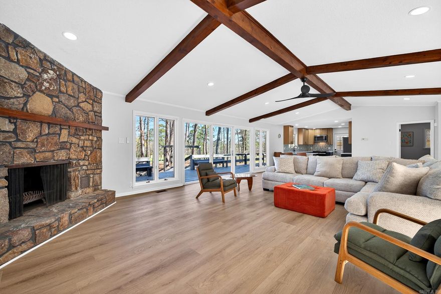 Experience the ultimate golf-course lifestyle in this stunning home overlooking the 18th fairway of DeSoto Golf Course. Perfectly situated less than a mile from the HSV West Gate, you are within walking distance to the DeSoto Club, pickleball courts, and the community pool.  The interior boasts a massive open-concept Great Room featuring vaulted ceilings with wooden beams, a floor-to-ceiling stone fireplace, and modern LVP flooring throughout. The kitchen is a chef’s dream with fully updated custom cabinetry with quartz countertops.  This functional split floor plan ensures privacy, featuring an oversized Primary Suite designed for relaxation. Notably, every bedroom includes its own walk-in closet, providing exceptional storage. Outside, enjoy over 70 feet of expansive decking and a charming pergola overlooking the green.  Storage continues with an oversized two-car side-entry garage, perfect for a workshop or golf cart. Combining modern luxury with a prime location, this golf-front gem is move-in ready.