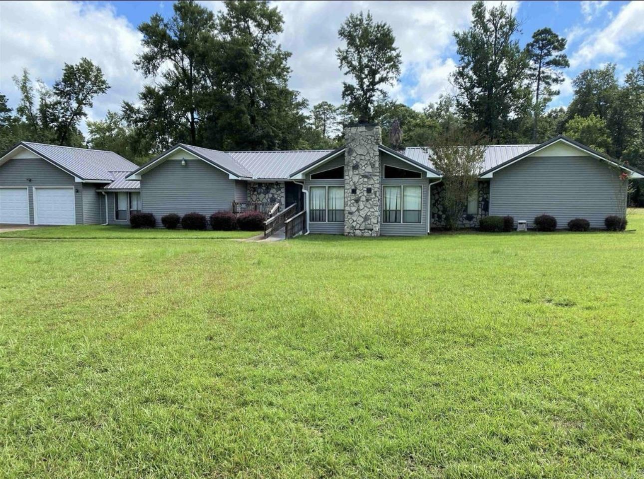Great property that sits on two acres. Home has metal roof and tons of living space to update and make it your own.