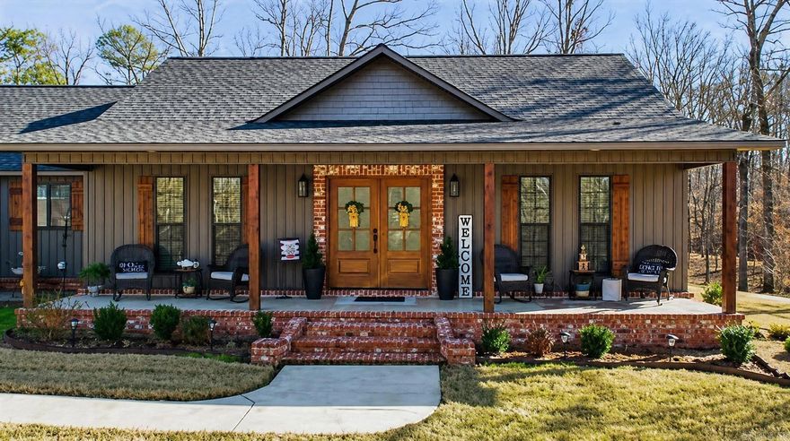 This beautiful yet secluded home near pristine Lake Ouachita is ready for its next owner. Built in 2022, with nearly 2,400 sq ft of thoughtfully designed living space and sits on 4.87 acres with a sodded yard and full Rainbird sprinkler system. A covered front porch spans the entire length of the home and welcomes you into a spacious entry featuring a formal dining room. The entry opens into a stunning great room with vaulted ceilings and a wood-burning fireplace with pellet heat, creating a warm and inviting atmosphere. The home is wired for a generator and includes built-in propane heaters in addition to central heat and air, offering comfort and peace of mind year-round. The open layout is enhanced by an island that separates the living area from the kitchen and breakfast room. Every detail has been carefully planned, from built-in appliance garages and specialty cabinetry to strategically placed electrical outlets. The split floor plan provides privacy and functionality. One side of the home features a laundry room, pantry, and a spacious primary suite with a large bath and two walk-in closets. SEE DOCUMENTS FOR COMPLETE DESCRIPTION.