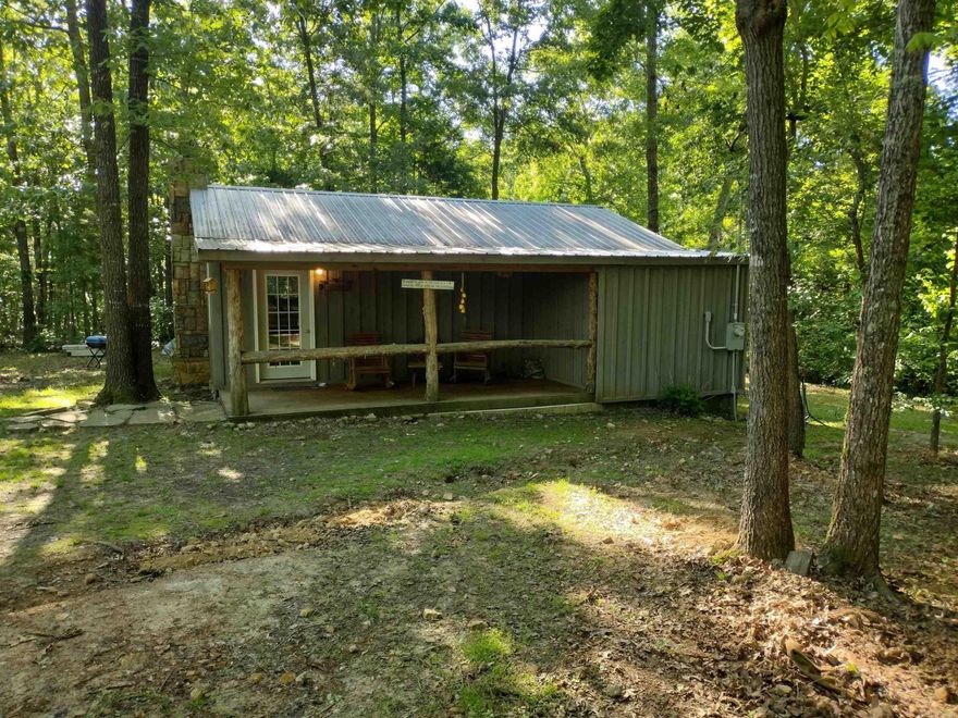 Check out this one bedroom one bath cabin joins Ozark National Forest make a great getaway place or would be great little home.