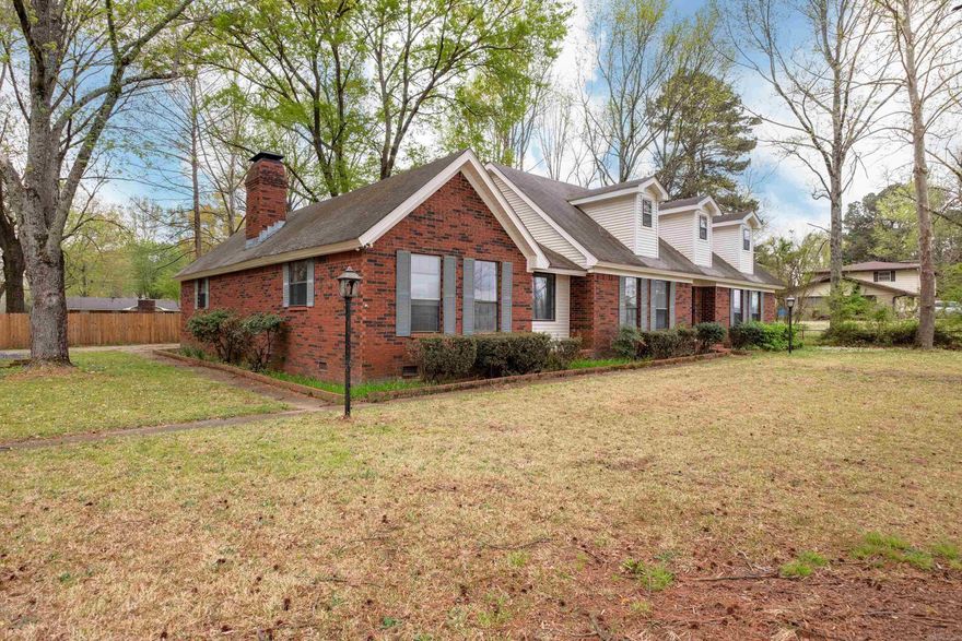 Step into this spacious and beautifully renovated two-story home, complete with a stunning two-story porch and deck that overlook a massive lot—over half an acre of outdoor space.  Inside, the great room boasts soaring vaulted ceilings and a striking custom lodge-like, rock fireplace, creating a warm and impressive focal point. The kitchen and bathrooms have been updated.  Upstairs, you'll find a convenient laundry chute and one of two master suites—perfect for flexibility in living arrangements. The second master suite is located on the main level, ideal for guests or multigenerational living.  In 2010, 1,250 sq ft was added to the rear of the home, significantly expanding the living space. The versatile floor plan offers excellent potential for an in-law suite or a spacious private home office. With ample room throughout, this home is perfect for remote work and comfortable shared living.  Don’t miss the chance to own this one-of-a-kind property—schedule your showing today!