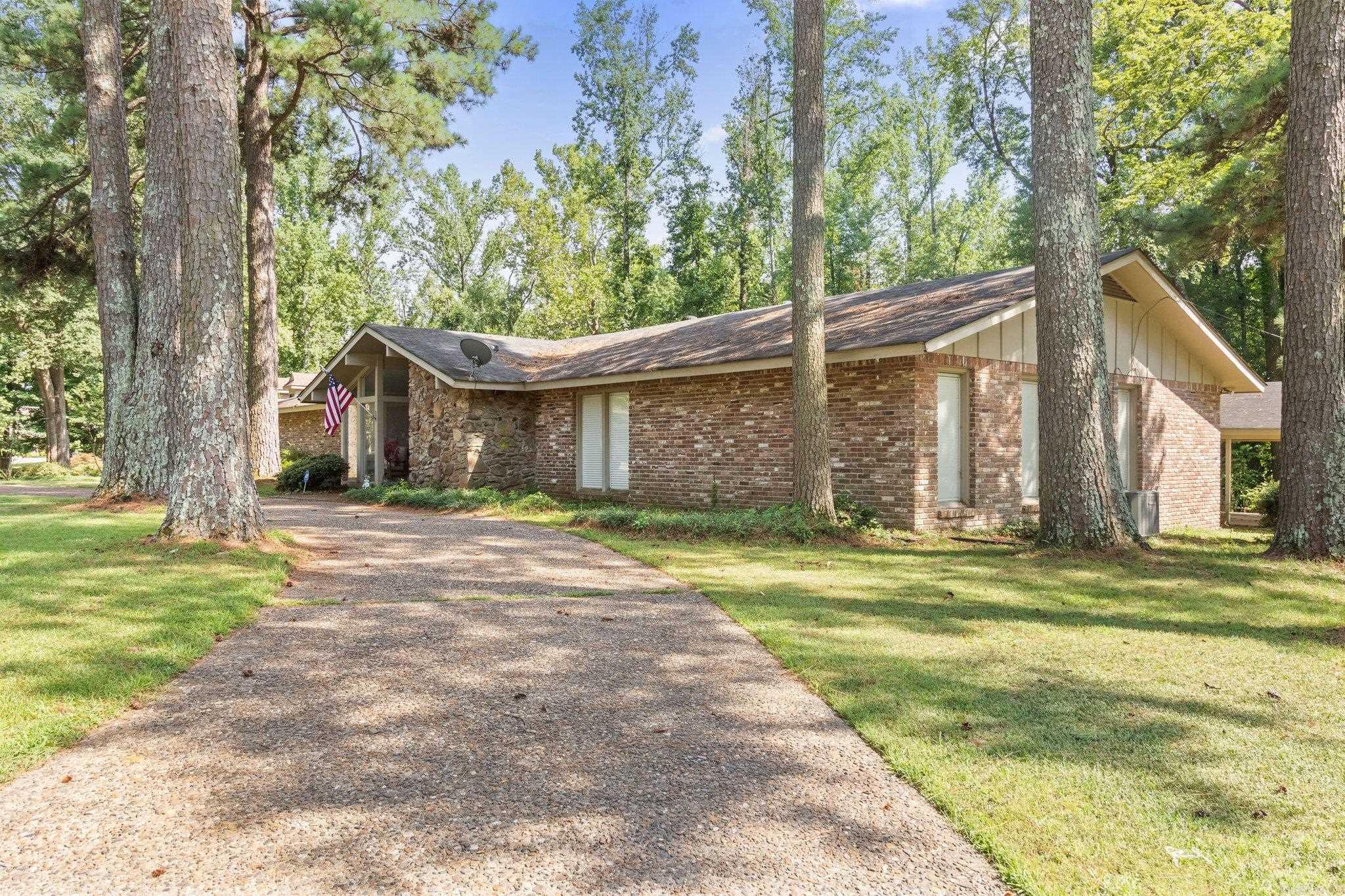 WELCOME TO THE MARKET! This home is located in a well established neighborhood in South Pine Bluff and sitting on a beautiful corner lot. Completely updated with almost 4000 square feet of modern living and timeless charm. You have four bedrooms with two and a half bath, new appliances, large master suite with his/her designer walk in closets and a master jacuzzi tub. There is a kitchenette in the 2nd family room with a bonus workout area. This home boasts a back up generator that will service the entire home should there be a power outage. A home office, a beautiful entry way with a brick wall, and a formal kitchen off the main kitchen area. Walk outside to beautiful brick patio that will great for entertaining guest or just sitting and watching the activity on the golf course across the street at the country club. Call and set up your showing today.