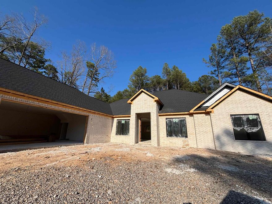 Experience refined new construction by Guerrero Custom Homes at 81 Elcano Drive in Hot Springs Village. This all-brick home is currently under construction and thoughtfully designed with 3 bedrooms, 3.5 bathrooms, and approximately 2,384 square feet of well-planned living space. The layout offers generous room sizes, a seamless flow between living and entertaining areas, and the quality craftsmanship Guerrero Custom Homes is known for. Solid brick exterior construction provides both timeless curb appeal and long-term durability. Positioned at just about a 4-minute drive to Diamante Country Club and conveniently located near the East Gate entrance, this home offers a rare balance of accessibility and private club lifestyle. Buyers may have the opportunity to select certain finishes and design elements prior to completion, subject to builder approval, allowing for a more personalized touch before move-in. Projected completion date to be determined. Home is currently under construction. First-time Village property owners are subject to a $2,000 POA buy-in fee. This is an opportunity to secure brand-new construction in a prime Village location before completion.