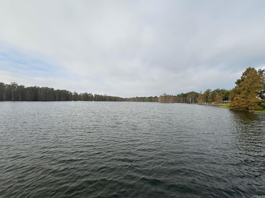 This is the last waterfront lot in the subdivision in a gated subdivision. If you have ever dreamed of building on quiet little lake near the big city, this is your opportunity. The lot is approximately 150 x 320 and is ready to build! No lot clearing, very little if any dirt work will be needed. Besides a great view the lot currently features a two boat stall 30 X 35 boat dock. The dock is currently available as part of the sale; however, a neighbor may purchase the dock separate from the lot.