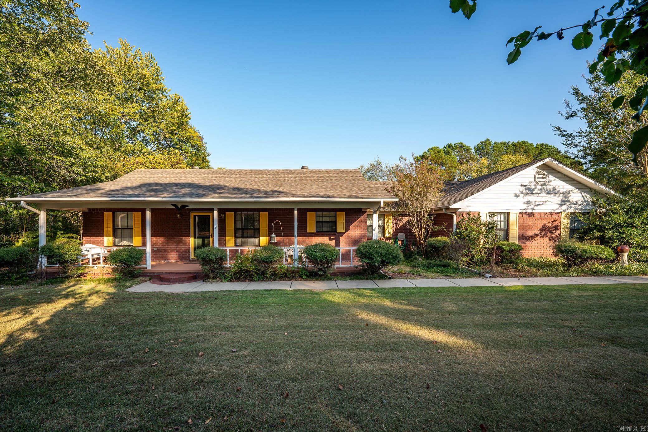 Welcome to this charming home in the Springhill area, Greenbrier School District and only minutes to Conway. This house has an open/split floor plan and plenty of room to enjoy the outdoors. Large covered front porch, side entry garage and decked back porch with new stain. This house also includes a sunroom/man cave, spacious bedrooms and a heated and cooled enclosed work shop area off the garage. Propane hookup in living room to heat the house if electricity goes out and NEW ROOF. Outside you will find a 28'X20' shop with electricity and 2 outbuildings for extra storage. Schedule your showing today! Agents see remarks.