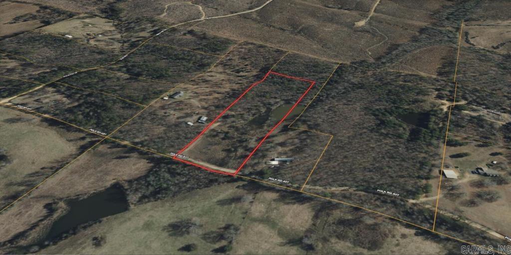 No zoning, HOA, or deed restrictions on this unrestricted gem with access from Polk Rd 407! Build your dream home or subdivide—no lot minimum. A serene pond and small creek enhance the natural charm. Electricity is nearby; well and septic needed. Just 26 minutes to Mena for parks, golf, the Polk County Fairgrounds, and the AR Native Plant & Wildlife Center. Only an hour to Broken Bow Lake, ziplining, and Cedar Creek Golf Course.