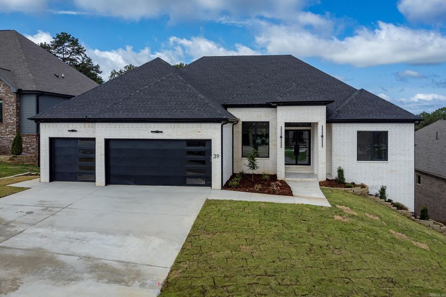 Magnificent new home with mountain view from the front cul-de-sac.  Attention to detail in every corner of this home with three bedrooms on the main level and three on the lower level all with private baths.  Great room has decorative gas fireplace with built-in bookshelves.  Stunning kitchen with large island and separate coffee bar area.  Sun room overlooks backyard and is located off of the Great room and kitchen.  Luxurious primary bath with double closets leading to laundry room.  Lower level has Family room with beverage bar area.  Deck has grill and walks out to large yard tree lined yard.  Don't miss this one, come see!