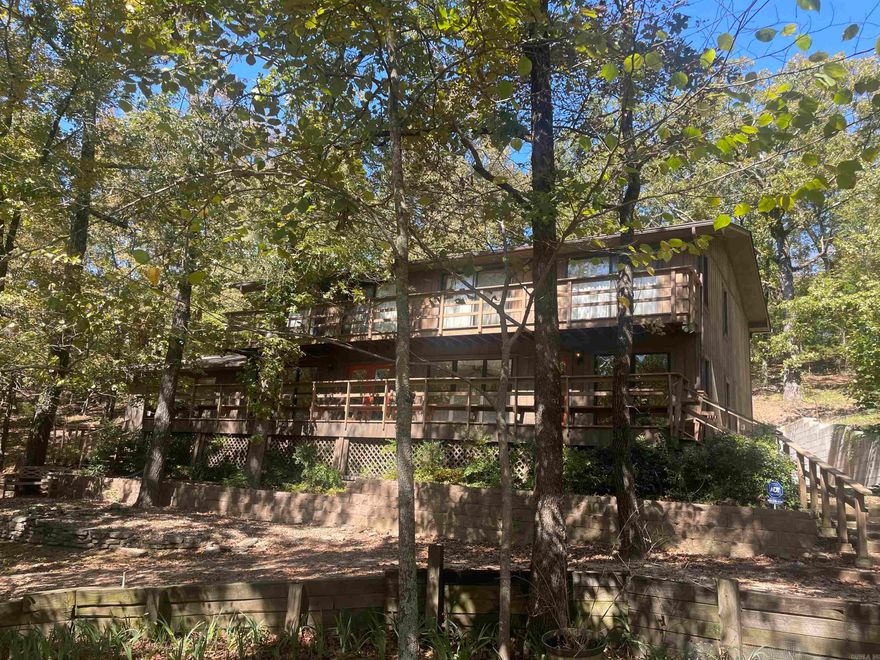 Your own private valley! Gorgeous 13.25ac mostly cleared, fenced, 2 barns, corral, pond, and protected by wooded hillsides. Large 5br 3ba home with 24x24 den. Shop with greenhouse. A little slice of Eden!
