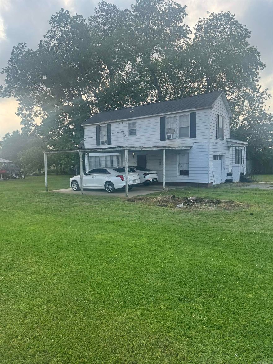 This home is located in the peaceful surroundings of Pine Bluff AR. This Charming property offers the perfect country living just a few minutes away from all the amenities. This home has 2 levels and a sunroom. This house offers plenty of space and convenience. This home sits on 2.47 acres ideas for gatherings, gardening, or simply unwinding after a long day. Don't miss the opportunity to make this beautiful property your next home. Bring your best offer.