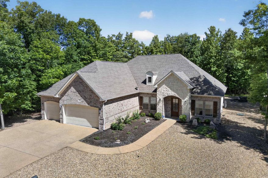 Meticulously cared for newer construction in Hot Springs Village on an almost half acre lot. This home features an open concept layout with beautiful wood floors, a spacious great room filled with natural light, and quality finishes throughout. The kitchen offers granite countertops, double ovens, a large pantry, and plenty of cabinet space, making it perfect for both everyday living and entertaining. Relax in the spacious primary suite with a stunning Roman tiled shower. Deep 3 car garage provides excellent storage, workspace, and room for larger vehicles or recreational equipment. Screened in back porch. Situated on a large peaceful lot in the gated community of Hot Springs Village with access to golf, lakes, trails, fitness centers, and more. Move-in ready with thoughtful details throughout!