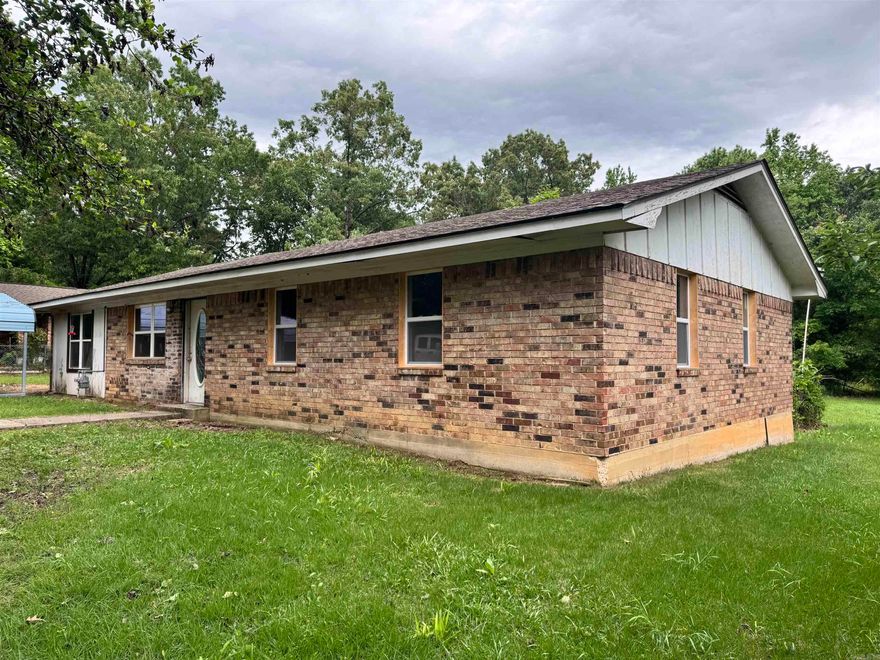 Charming property located inside the city limits of Grannis, sitting on a .39-acre lot with plenty of potential! This 3-bedroom, 1-bath home also features an additional room that could easily be converted into a 4th bedroom, office, or flex space to fit your needs.  The home has already undergone major updates, including all new wiring, walls, ceilings, flooring, windows, and doors—giving you a solid foundation to finish it exactly how you want. Enjoy a beautiful, professionally done walk-in shower and the warmth of varnished tongue-and-groove pine boards that run throughout the home, adding character and charm.  The kitchen is ready for your finishing touches, making this a great opportunity for someone looking to customize their space or invest in a property with strong potential. Outside, you’ll find a convenient movable carport and plenty of yard space to make your own.  Whether you’re looking for a primary residence, rental, or project home, this property offers the hard work already done—just bring your vision to life!