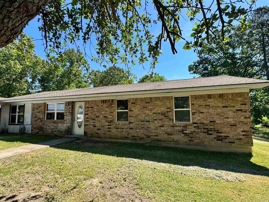 Charming property located inside the city limits of Grannis, sitting on a .39-acre lot with plenty of potential! This 3-bedroom, 1-bath home also features an additional room that could easily be converted into a 4th bedroom, office, or flex space to fit your needs.  The home has already undergone major updates, including all new wiring, walls, ceilings, flooring, windows, and doors—giving you a solid foundation to finish it exactly how you want. Enjoy a beautiful, professionally done walk-in shower and the warmth of varnished tongue-and-groove pine boards that run throughout the home, adding character and charm.  The kitchen is ready for your finishing touches, making this a great opportunity for someone looking to customize their space or invest in a property with strong potential. Outside, you’ll find a convenient movable carport and plenty of yard space to make your own.  Whether you’re looking for a primary residence, rental, or project home, this property offers the hard work already done—just bring your vision to life!