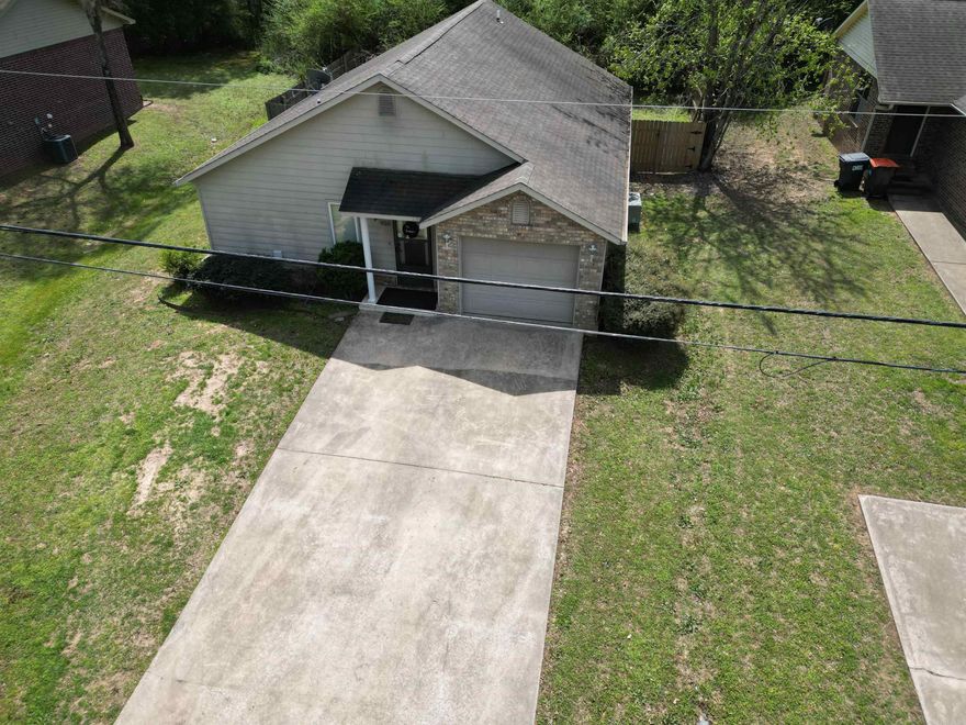 Split floor plan 3 bedroom/2 bathroom home with privacy fenced backyard. Small, ducted garage was enclosed, creating a large kitchen, dining, living area, which has a vaulted ceiling. Square footage is estimated from tax record. It is only minutes to I-40 and Arkansas Tech University.
