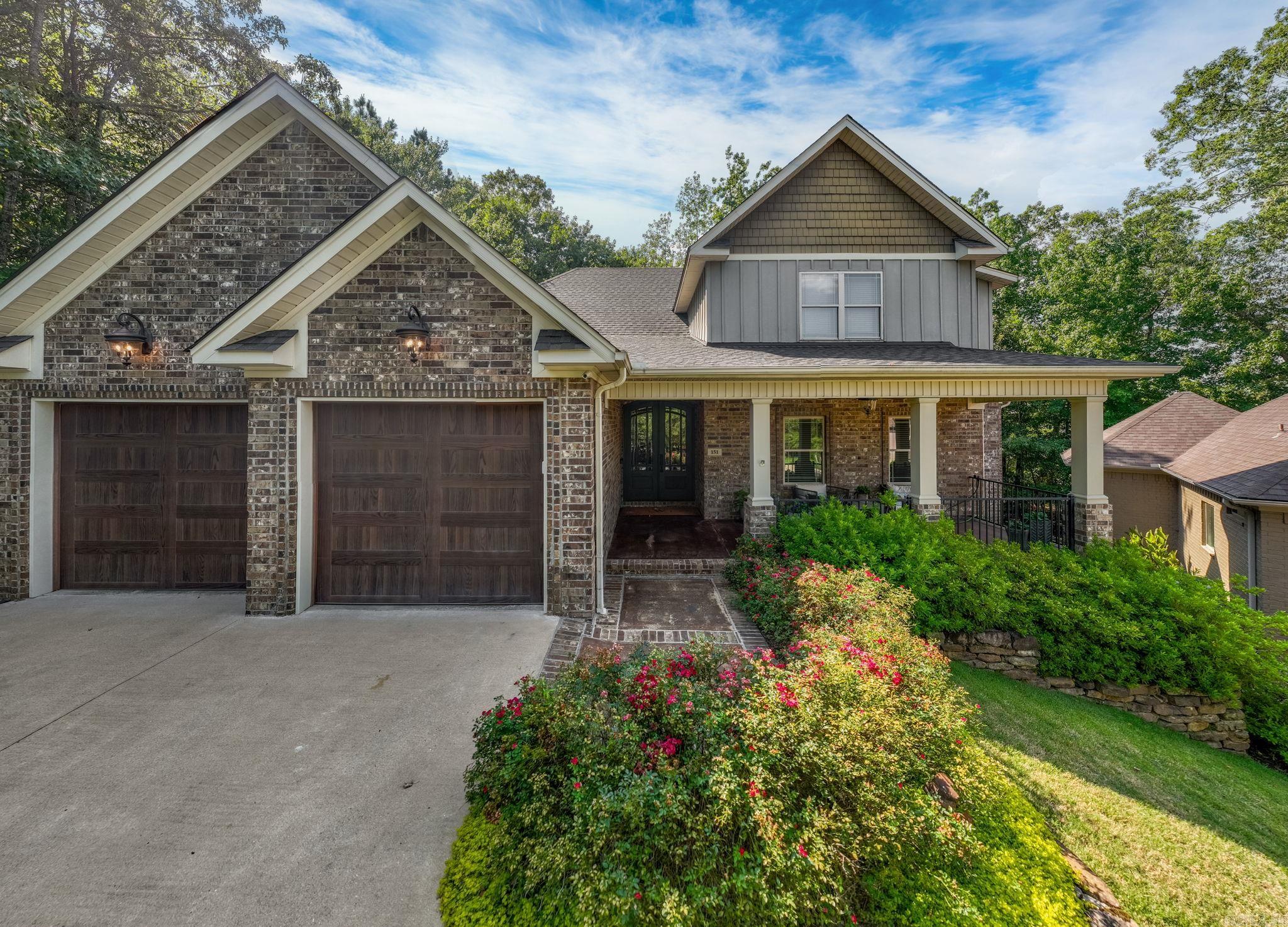 Nestled in the beautiful gated community of The Woods at Woodlands Edge, this home offers a serene setting surrounded by lush green space. Enjoy the beauty of the outdoors year-round from the covered patio with a fireplace or while relaxing in the hot tub on the deck. Open-concept main level is perfect for both everyday living and entertaining. The spectacular chefās kitchen features bar seating, a breakfast nook, abundant storage and breakfast bar seating. Spacious living area with fireplace and adjacent formal dining room currently being used as second living area. Large laundry room with amazing storage sits just off the garage for added convenience. Wonderful main-level primary suite along with an additional bedroom and full bath. Upstairs youāll find office space, nice guest bedroom, full bath, and fourth bedroom that can also serve as bonus room, playroom or home office with vaulted ceilings, closet and access to floored attic. Lots of designer finishes, natural light and upgraded touches. Come see!
