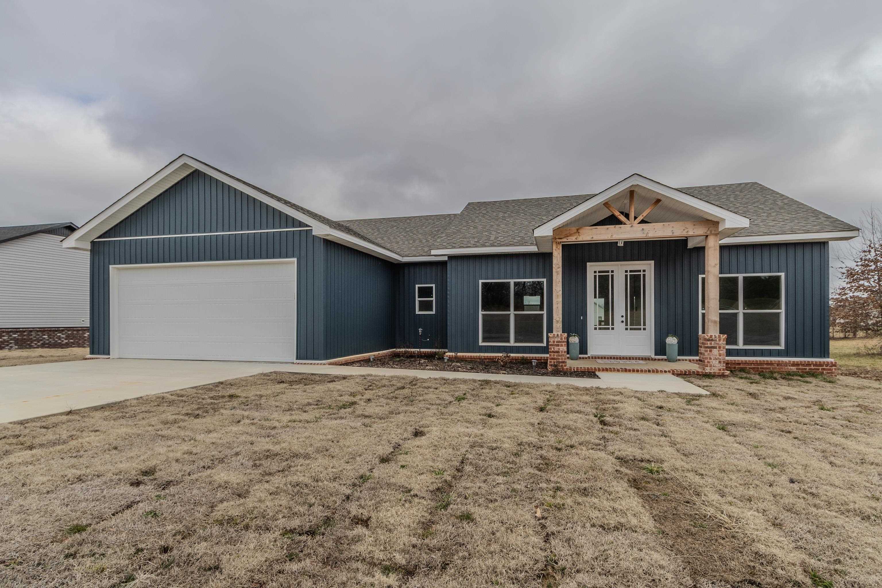 This New Construction home is absolutely beautiful! Sitting on a little over 1/2 an acre offering the perfect blend of modern and timeless charm. The eye catching exterior features beautiful blue siding, accented with brick and cedar details and a double door entry. Inside you will find soaring ceilings, stylish gold accents , and a spacious open concept layout. The kitchen boasts a large island perfect for entertaining. The primary suite is a true retreat, featuring a generous walk in closet, a tile shower and free standing tub. Ample storage throughout ensures the home has both functionality and style. Large garage provides plenty of space for vehicles and any storage needs.