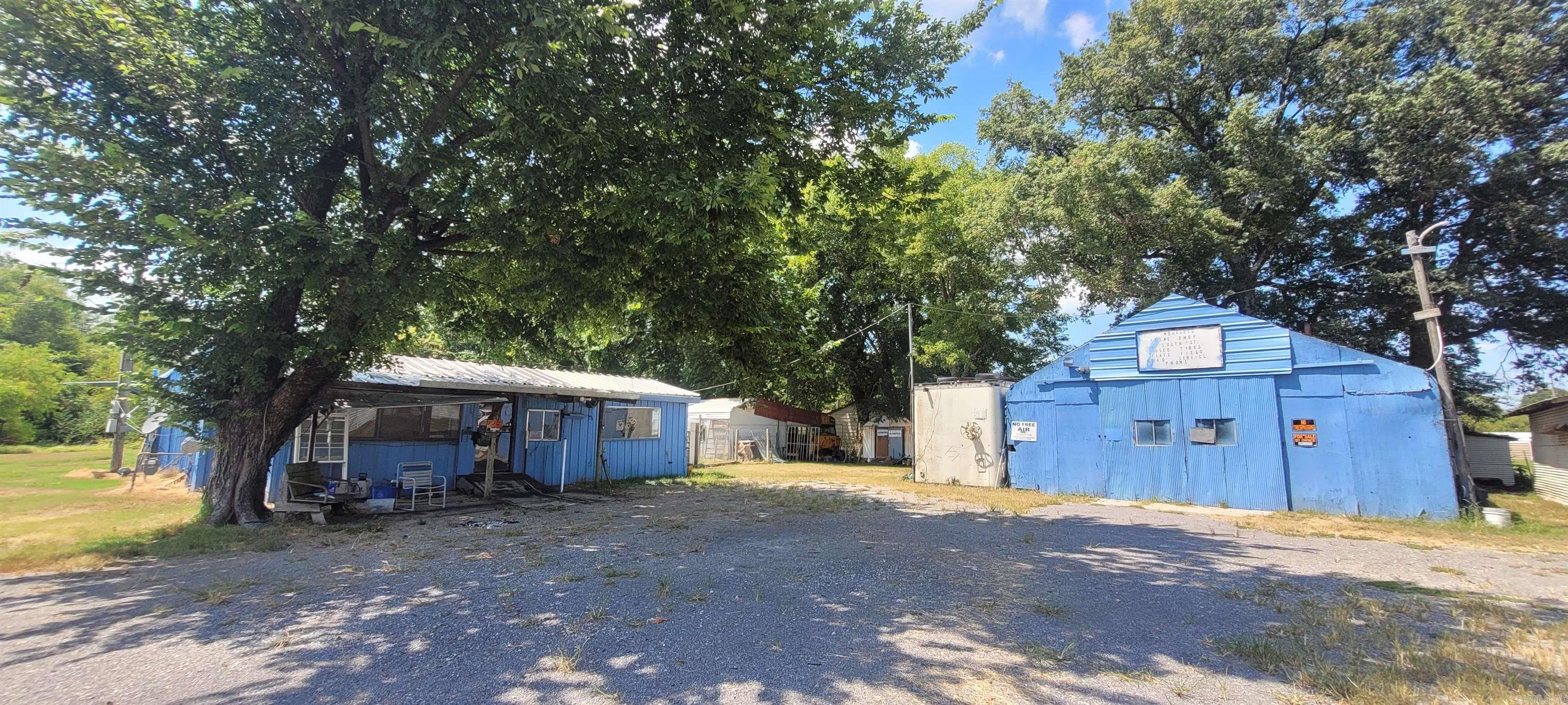 Fixer upper with shop. Potential for investment property. No central heat or air. No utilities on. Age is based on seller information. Square footage is estimated.