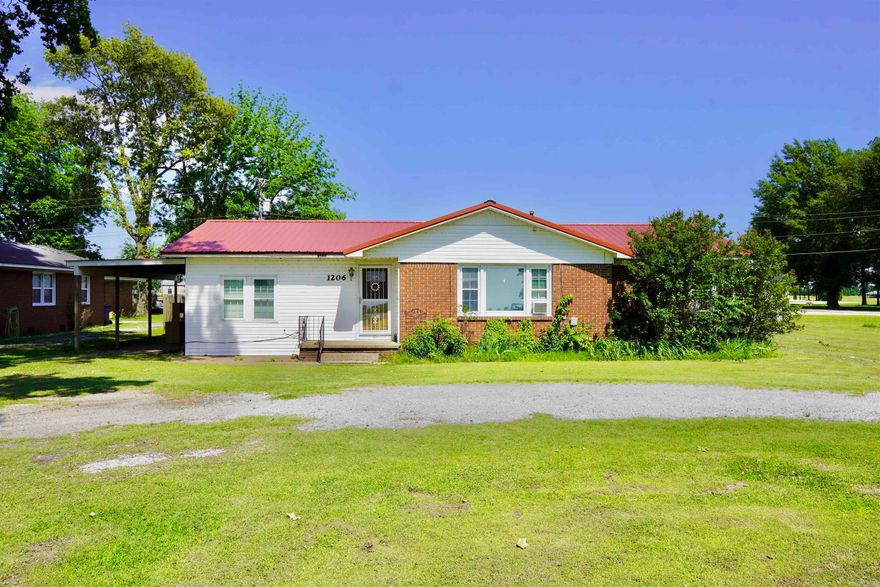 This 3 bed, 1.5 bath homes offers over 1300sqft and sits on a spacious half-acre lot. Features include an open kitchen and dining area, a spacious living room, and a carport. Located right in front of the Buffalo Island Central Elementary School. Perfect for future resale or rental appeal. With some TLC, this property has great flip potential.