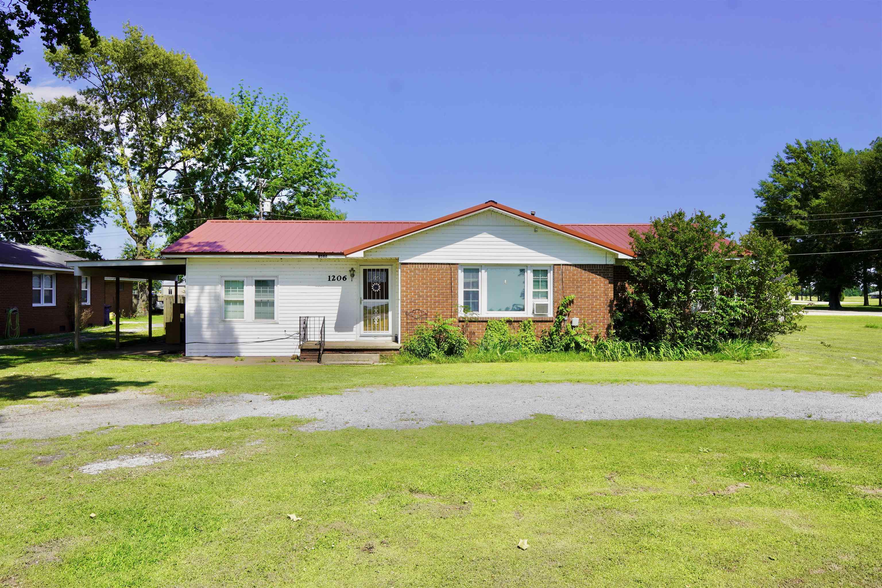 This 3 bed, 1.5 bath homes offers over 1300sqft and sits on a spacious half-acre lot. Features include an open kitchen and dining area, a spacious living room, and a carport. Located right in front of the Buffalo Island Central Elementary School. Perfect for future resale or rental appeal. With some TLC, this property has great flip potential.