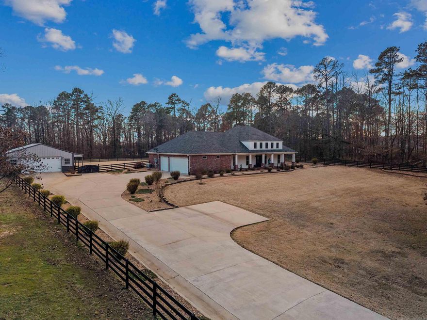 We found it—your own personal oasis just minutes from town! Located in Benton School District, this property is completely fenced with a gated driveway. As you enter, you’ll notice the meticulously maintained yard and beautiful landscaping. Inside, enjoy a spacious living area open to the kitchen. Two bedrooms and a full bath are located to the right, with a large pantry and laundry room down the hall. The primary suite features two closets, including a built-in safe room. A whole-home generator powered by a buried propane tank adds peace of mind. Out back, relax on the 600+ sq ft screened-in porch—perfect for entertaining. All of this plus a 3-car garage and a large shop with overhead doors on the front and side. Call today to schedule your showing!