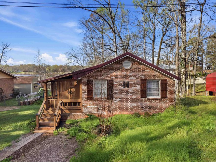 Adorable 2-bedroom, 1.5-bath cottage on beautiful Lake Conway! This charming lakefront home has been thoughtfully remodeled and is located in a quiet area, perfect for relaxing and enjoying lake life. Recent exterior updates include new brick, a new HVAC system, and a beautiful screened patio and deck ideal for entertaining or enjoying the view. Interior improvements feature hand-laid wood floors, updated kitchen cabinets, fresh paint, modern fixtures, and new appliances including a dishwasher and stove. The dock was completely rebuilt in December 2025, providing the perfect place for fishing, boating, or soaking in the peaceful surroundings. Whether you're searching for a weekend getaway, fishing retreat, or a cozy retirement spot, this move-in ready lake cottage is a must-see! (Adjacent lots available MLS#)
