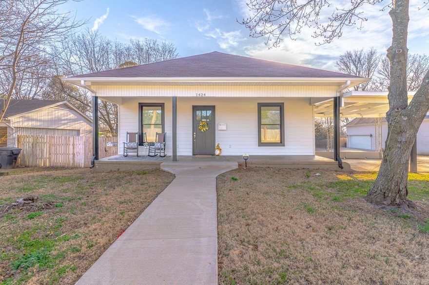Welcome to Market 1424 S Church Street of the Mangrums Subdivision in Jonesboro, Arkansas within the Jonesboro School District. Situated on a .12+/- acre corner lot in the heart of town is a renovated Craftsman Bungalow wrapped in vinyl and accented by a covered front porch, attached carport, wood privacy fence, guttering, and walkway. The interior features 1,480 sf of well laid out living space that contains a large living room, dining room, kitchen with stainless steel appliances, Master bedroom with walk-in closet, en-suite with dual vanity and shower/tub combo, 2 guest bedrooms, guest bathroom with shower/tub combo, and laundry room. Recent improvements include: HVAC, plumbing, electrical, fixtures, fresh paint, countertops, cabinetry, appliances, sod, and more.  You'll love the decorative front door, tall ceilings, crown moulding, wide baseboards, high-end fixtures, original hardwood floors, barn doors, and outbuilding in the backyard. Conveniently located near favorite local amenities. Move-in ready and priced to sell. Call today to schedule your tour and make this house your home or next addition to your rental portfolio.