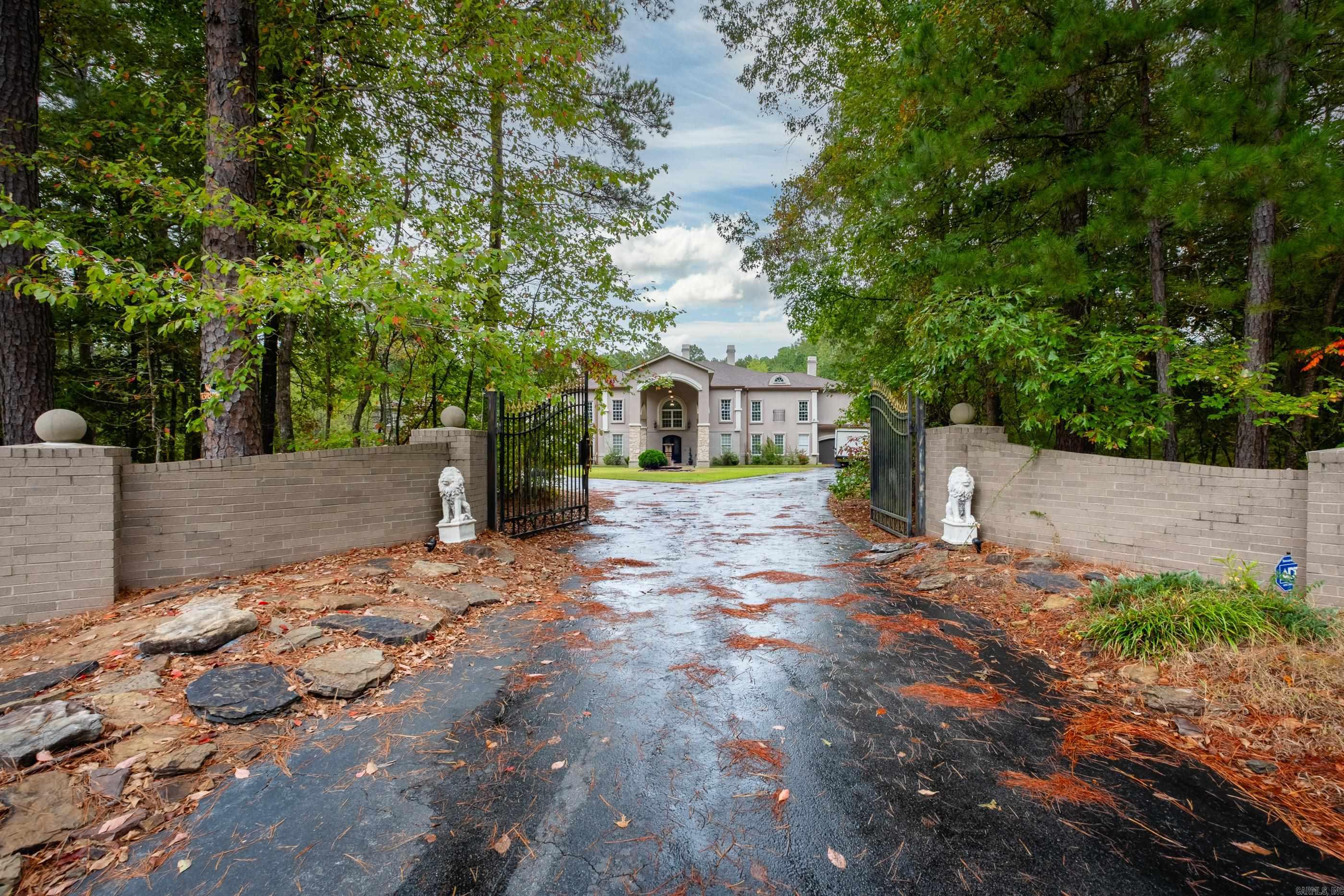 This special estate with lots of potential is not for everyone. Not all can appreciate this extremely unique home with approx. 9000 sf sitting on over 3 acres. You must have vision to want a property that features 8 bedrooms and 5 & 1/2 baths with a separate guest quarter over one of the many garage areas. You can only dream about having a theater room, a game room, your master bedroom with a fireplace, two laundry rooms, an entry foyer with 32 ft ceilings and a beautiful kitchen opening up to a spacious family room. Priced only for serious buyers and needing a pre-approval letters or proof of funds for any showings. Note upstairs area is needing major attention to be fully completed. Property to be sold "AS IS". No repairs by sellers-decorating allowance provided. Located a few minutes from Little Rock in the Maple Creek subdivision. Agents please check remarks.