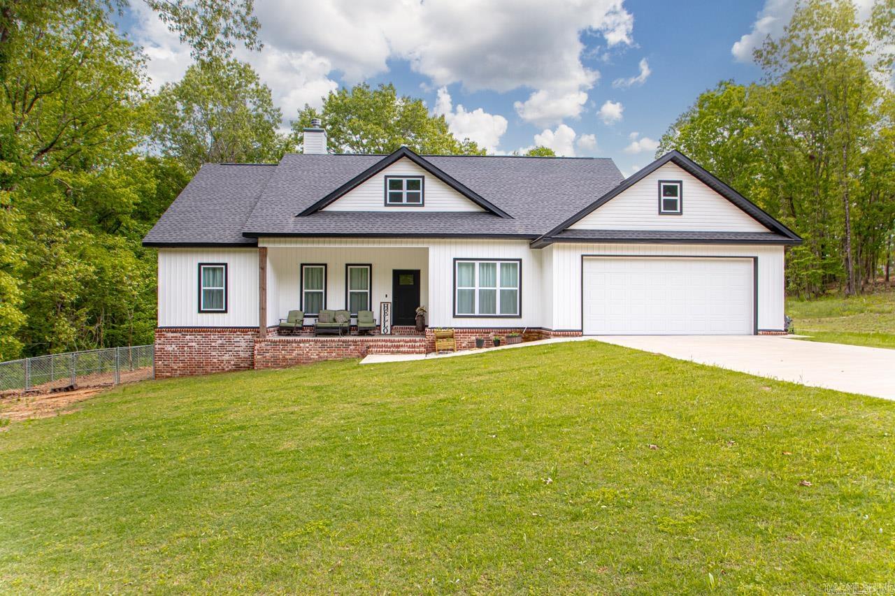 LOVE PORCHES?? This is your house!! This custom home built with a farmhouse style is absolutely stunning. Located in one of the most well desired neighborhoods in East End. (Springwater) Home has 4 bedrooms with 2 full bathrooms. Split plan. One bedroom is off the living room that could be an office as well. Woodburing brick fireplace with mantle. Open Kitchen, Living Room and Dining area. Open island with additional seating. Wall oven and microwave. All electric home. Custom tile shower in primary bath with a separate soak tub. Double vanities and huge walk in closet in the primary sweet. Large laundry room off the garage entrance and large walk in pantry. The back porch is stunning and has a great back yard for cookouts, pets or just playing. Very private backyard with woodbine behind the home. You will not want to miss out on this home less than 2 years old. Please see remarks!!