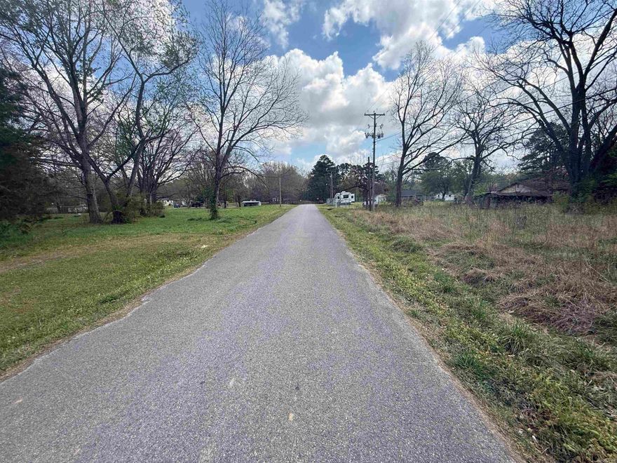 The lot has a old house on it the could be redone or will need to be removed.  Has large trees, nice storm shelter, mobile home  / rv hook up with water meter, power pole, outbuilding, and lots of open area. There is a tiny home just down the street.