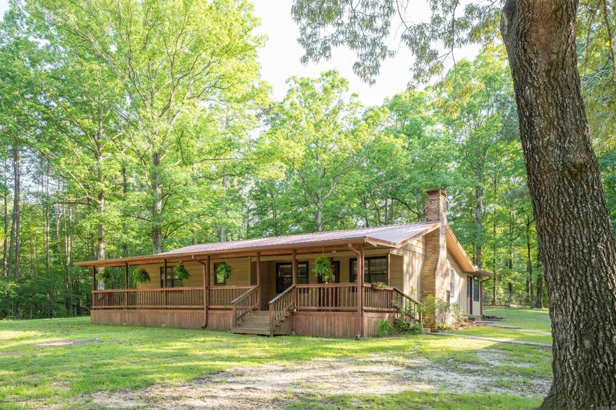 Welcome to this clean and well maintained 3-bedroom 2-bath home on 1.25 acres. Inside you'll find brand new carpet in the bedrooms and a very spacious living area with wood burning fireplace. Outside, the property has a detached 2-car carport with a 14' X 20' storage room and a 2-bay shop measuring 30' X 20', perfect for those in need of additional space.