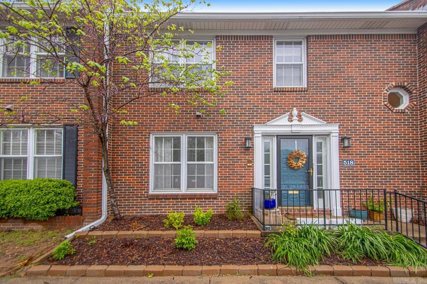 Welcome to this ideally located condo!  The lower level features a spacious bedroom w/an adjoining full bath. The kitchen is truly the heart of the home, boasting beautiful granite countertops & sleek stainless steel appliances. It’s the perfect space for preparing meals, whether for yourself or while entertaining guests.  The living area is equally inviting, with a cozy fireplace adding a touch of warmth & ambiance to the space. Large windows allow plenty of natural light to flood in, flowing effortlessly into the dining area. Just off the living room, the outdoor space is a true highlight. Backing up to a tranquil green space, this private retreat offers the perfect setting for relaxing.  Upstairs, you'll find the spacious master suite. This large room includes its own fireplace, a private balcony, & a cozy sitting room lined with bookshelves. This versatile space could be used as a nursery, home office, or an extra-large closet. The master bath features a double vanity.  An additional room upstairs offers a bright & airy space complete with a charming window seat & abundant built-in storage. The upstairs bathroom has also been completely renovated, offering a modern, fresh feel.