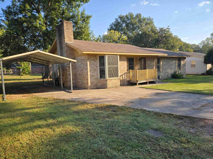 Welcome to 604 Oregon Street, Beebe, Arkansas! This charming 3-bedroom, 1-bath home has been freshly painted, offering a bright and welcoming atmosphere from the moment you step inside. Enjoy a spacious living room with built-ins and a cozy wood-burning stove, perfect for family gatherings or relaxing evenings. New energy-efficient windows throughout the home not only enhance comfort but also keep heating and cooling costs low.  Step outside to a large backyard, ideal for entertaining or simply unwinding. With a spacious deck and a beautiful shade tree, it’s a true outdoor oasis. The single-car carport adds convenience, protecting your vehicle from the elements. Don't miss out on this move-in-ready gem in Beebe! Schedule your showing today!