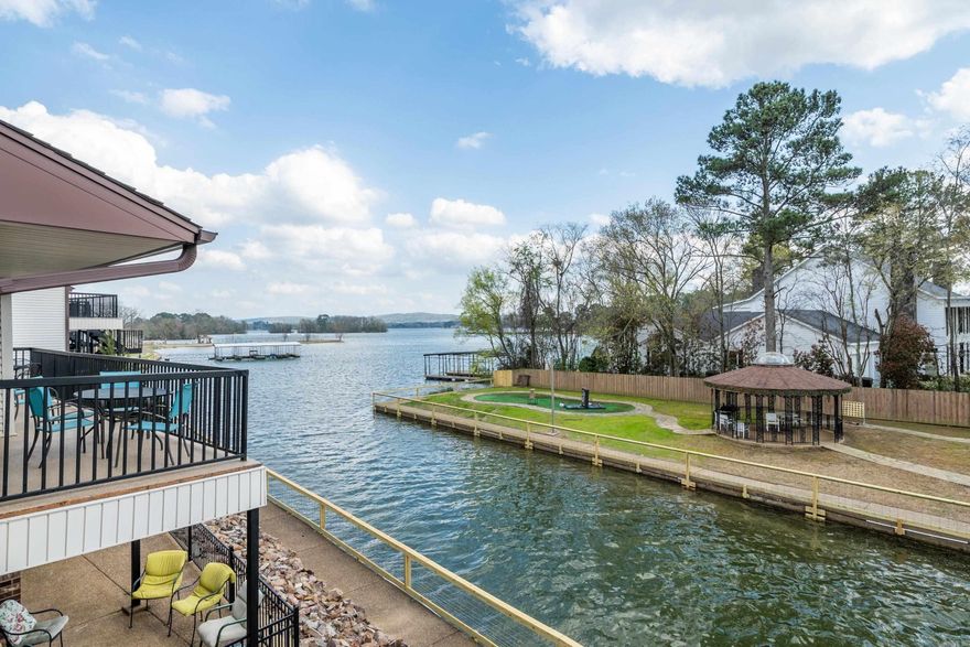 Welcome to your cozy retreat at 5371 Central #4D in Hot Springs, AR. This charming 1,467 sqft, 2BR/2BA condo is an ideal choice for nightly rentals, offering a perfect blend of comfort and allure, with stunning views of Lake Hamilton. Designed for relaxation, it features a fully equipped kitchen and inviting living spaces, ensuring guests feel right at home. Outdoor amenities enhance the experience, including a large pool, hot tub, kayaks, pickleball courts, and A COVERED BOAT SLIP, inviting leisure and adventure. Positioned in a prime location, this property is a fantastic short-term rental investment, promising high demand and consistent rental income. Experience the warmth of a home-away-from-home in one of Hot Springs' most picturesque settings. This property is more than just a place to stay; it's a gateway to memorable experiences, making it a smart investment for those looking to capitalize on Hot Springs' thriving STR market. The POA covers Wi-Fi, cable, water, and abundant amenities, including pickleball, mini golf, and shuffleboard. Guest and overflow parking available. NEW HVAC installed Dec. 2022.