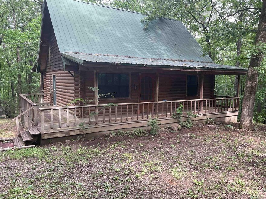 LAKEFRONT CABIN ON GREERS FERRY.  What a great cabin at a great price.  Main level has open den/dining/kitchen with large breakfast bar & patio doors to rear deck, Upper level has loft space, bedroom & 1/2 bath.  Lower level has 2 bedrooms, full bath, large laundry & outside patio area. Kitchen has lots of counter space, elec. range, refrigerator & lots of cabinets plus a large dining area.  Nicely situation in a private setting and gentle walk to the water's edge you will enjoy the rear deck, covered front porch and a separate detached deck area. FURNISHINGS NEGO. Just minutes from launching your boat at Sugar Loaf Marina or keeping your boat in a boat slip at the Marina (which is full service). GREAT CABIN, GREAT LOCATION, GREAT PRICE.