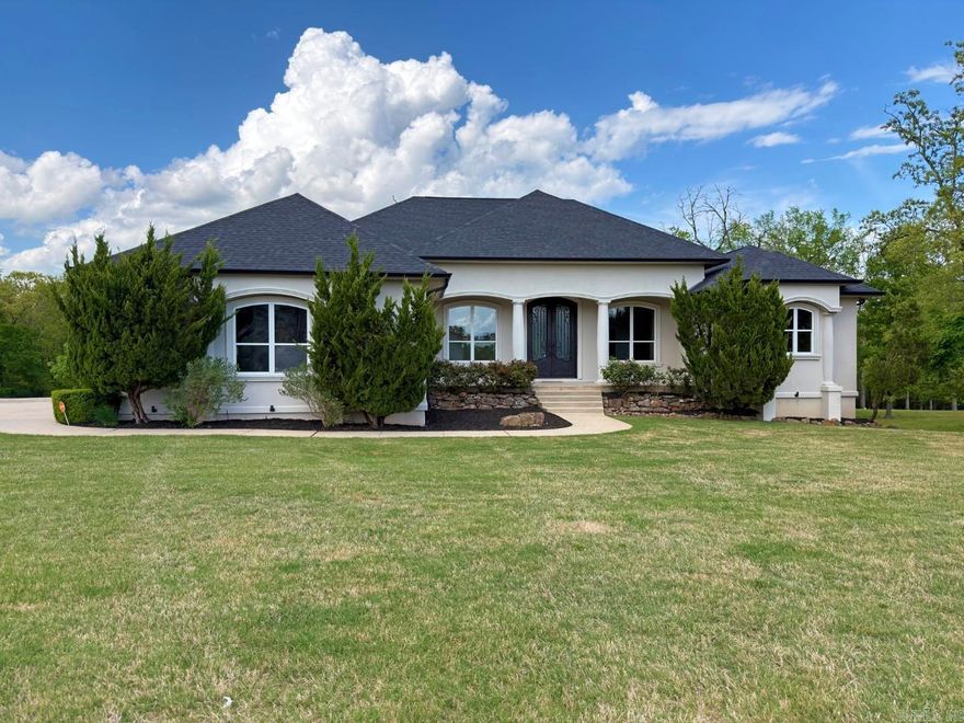 Exquisite Mediterranean/Tuscan Style Home on 1.48 acres in Hot Springs, just miles from Lake Hamilton access! This 5,806 sq. ft., 6 bed, 3.5 bath w/ an in-ground pool and mother-in-law suite, resides in a small gated community. Some of the highlights include: custom kitchen w/ Thermador appliances, walk-in pantry, 3 living areas, massive theater room, large covered back patio, library, built in safe and more! The mother-in-law suite is a full apartment complete with kitchen, living room, bathroom and bedroom! Outside you'll love the manicured yard, fire pit area, fenced in pool, custom dog house and 2 big storage areas. Recent updates include a new architectural shingle roof, new seamless gutters & fresh paint. All of this is priced to sell at less than $155/sq. ft. so check it out today!