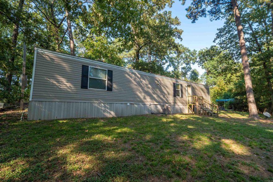 Affordable 2-Bed, 2-Bath Mobile Home Surrounded by Nature Looking for peace, privacy, and a budget-friendly place to call home? This 2-bedroom, 2-bath mobile home sits in a quiet area surrounded by woods, offering a relaxing setting without breaking the bank. The home itself could use a little TLC, but it has everything you need at an affordable price. With its low cost and private location, this property also makes a great investment opportunity—perfect for a long-term rental. Schedule a showing today and see the potential for yourself!