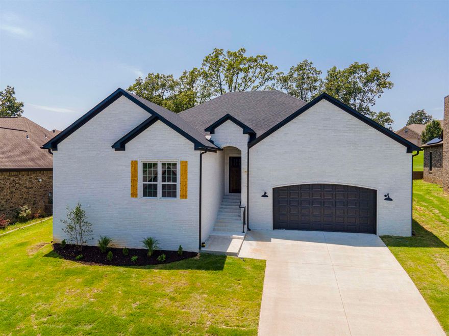Gorgeous light colors with wood and black accents are in this white brick, 1 story new construction home. 8817 Stillwater has an open floor plan form the living room to the kitchen and dining area. There are large windows that let the natrual light pour in and fill the home. The living room has a cozy fireplace and open shelving. The kitchen is incredible with white granite countertops and a wood wrapped island and the large dining area leads to the covered back patio & yard. The bedrooms have comfy carpet & the master ensuite has dual vanities a black spa tub, separate standing shower, and a walk in closet. There are 3 more bedrooms on the other side of the home for kids, guests, or home offices spaces and ALL of this is located in the desirable Creekside Subdivision in Sherwood that is close to everything and feels like a small community.  Go see it today!
