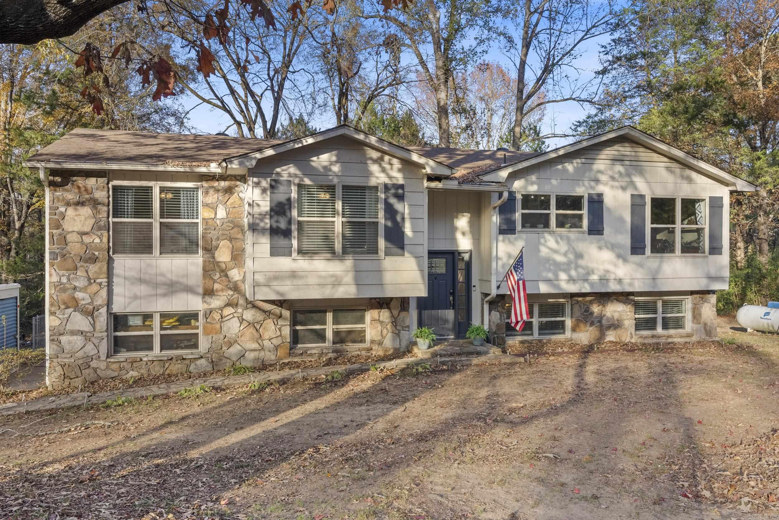 ***SELLER OFFERING $5,000 CREDIT TOWARDS BUYERS CLOSING COSTS*** Nestled in a desirable, quiet neighborhood on nearly 2 acres near Beaverfork Lake! This spacious home has a lot to offer with a ton of updates/upgrades including real wood floors, granite kitchen counter tops, stainless steel appliances, remodeled full bathrooms including jacuzzi tub with subway tile to the ceiling and new tall shower head, NEW interior paint, NEW carpet in 3 bedrooms & stairs, NEW back roof with whirly birds, NEW HVAC w/ transferable warranty (1.5 yrs old), NEW 12x30 storage building w/ 2 lofts, NEW back deck stairs & stain and NEW septic lines. Relax or entertain on the large wood deck that overlooks the huge fenced backyard. Kitchen refrigerator, 5 tv mounts, AT&T security system, Ring doorbell & camera, storage building & survey included. Fiber internet included and homeowners have exclusive access to private park and dock on Beaverfork Lake. Won't last long! Agents see remarks.