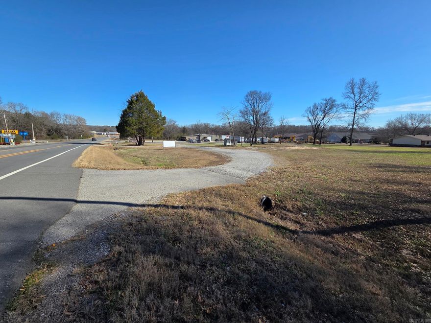 Nice corner lot with high traffic counts, 2 driveways & over 300' Hwy frontage. It also has frontage & a 3rd access off Evening Street. It had served as a BBQ food truck spot in the past before owner retired. It has a concrete pad, power pole with electrical box, freeze proof faucet & security light still in place. New owner may could get with city & split it up & run several businesses since it has 3 drives & over an acre of land. It could make a great car or trailer lot, retail or strip mall, storage facility, auto garage, professional building or office space. It has endless opportunities!