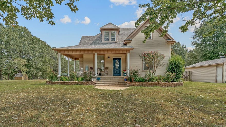 Step into timeless charm with this beautifully maintained home, originally built in the 1900s and thoughtfully updated for modern living. Offering three spacious bedrooms, three full baths, and almost 3.5 acres of land, this property is truly one-of-a-kind. The home is fully furnished and turn-key ready, allowing you to settle in with ease. Almost 2200 sf of living space all electric. Inside, the island kitchen shines with cherry-stained cabinetry, tiled flooring, double ovens, and double dishwashers—perfect for cooking and gathering. The main floor features a formal dining area, built-in desk space, and a cozy den that could also serve as a fourth bedroom. The primary suite, complete with ensuite bath, is located on the main level, while the laundry room includes an additional bath for convenience. Upstairs, you’ll find two more bedrooms and another full bath, providing plenty of room to spread out. Outdoors, enjoy a detached garage, fenced and cross-fenced areas, and wide-open space for your lifestyle needs including a new composite deck to enjoy. With a roof and HVAC updated within the last six years, this home blends history, character, and peace of mind. See agent notes