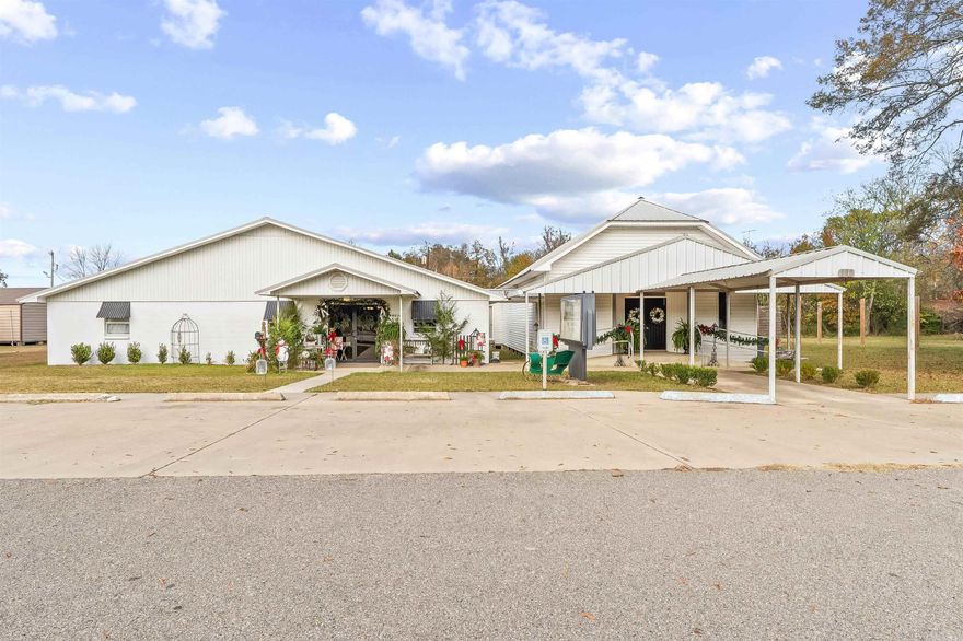 This property is currently being used as a Floral Business but has potential to make a nice residence. The main building has approximately 2200 sq ft. and has a full kitchen full of cabinets and 2 cook stoves. There are 2 large bathrooms with 2 stalls. One of the stalls could easily be turned into a shower. The great room is large and you can build your own footprint for additional rooms. The other building is an old chapel with 1898 Sq Ft. that has two smaller rooms. Both buildings have Central Heat and Air and have been remodeled recently.